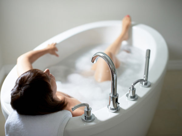 Top view of a serene mature woman in bathtub